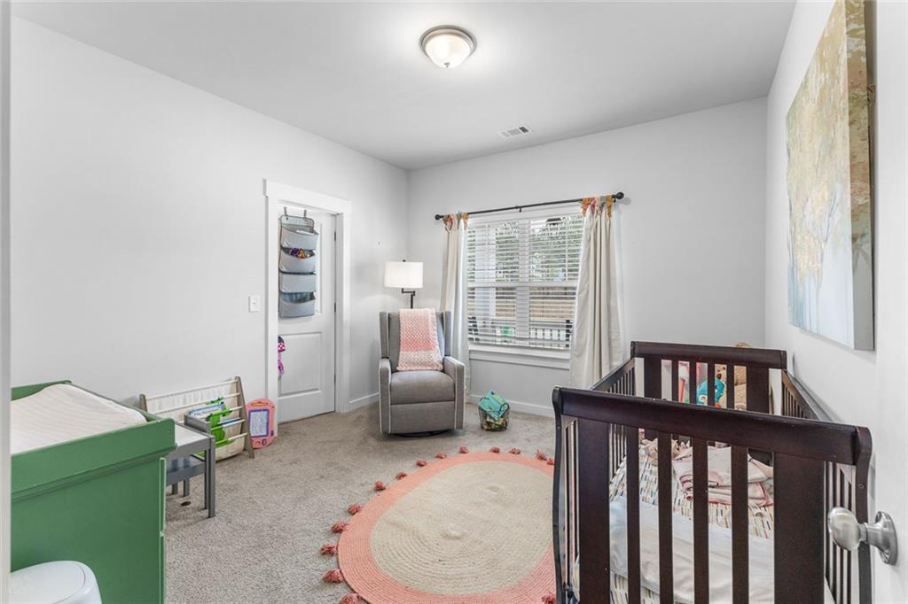 2253 Cotton Gin Row Jefferson, GA 30549 - Photo 22 of 45 a bedroom with furniture and a window