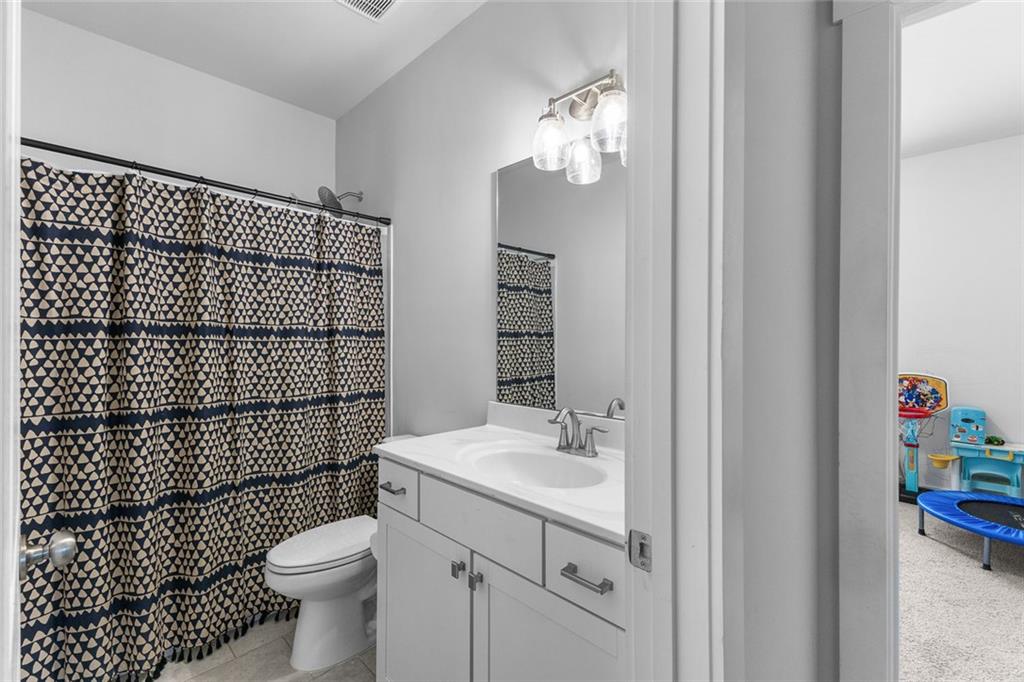 2253 Cotton Gin Row Jefferson, GA 30549 - Photo 23 of 45 a bathroom with a sink toilet and shower