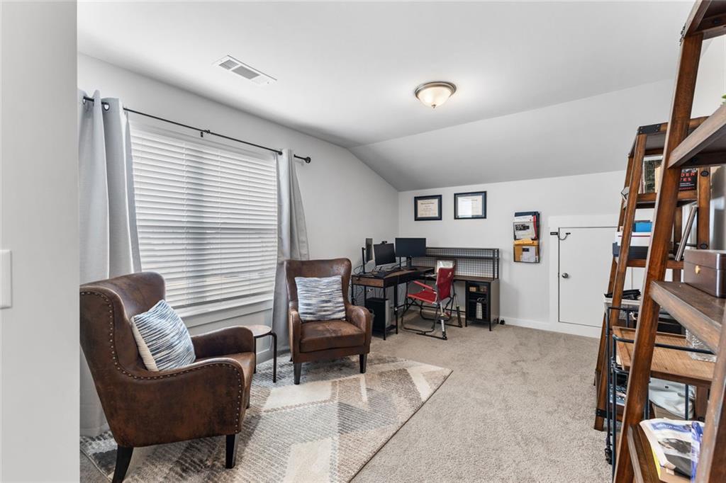 2253 Cotton Gin Row Jefferson, GA 30549 - Photo 26 of 45 a view of a livingroom with workspace and a couch
