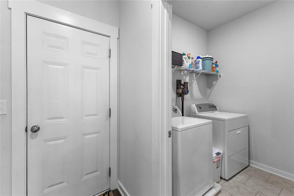 2253 Cotton Gin Row Jefferson, GA 30549 - Photo 30 of 45 a room with a refrigerator and cabinets