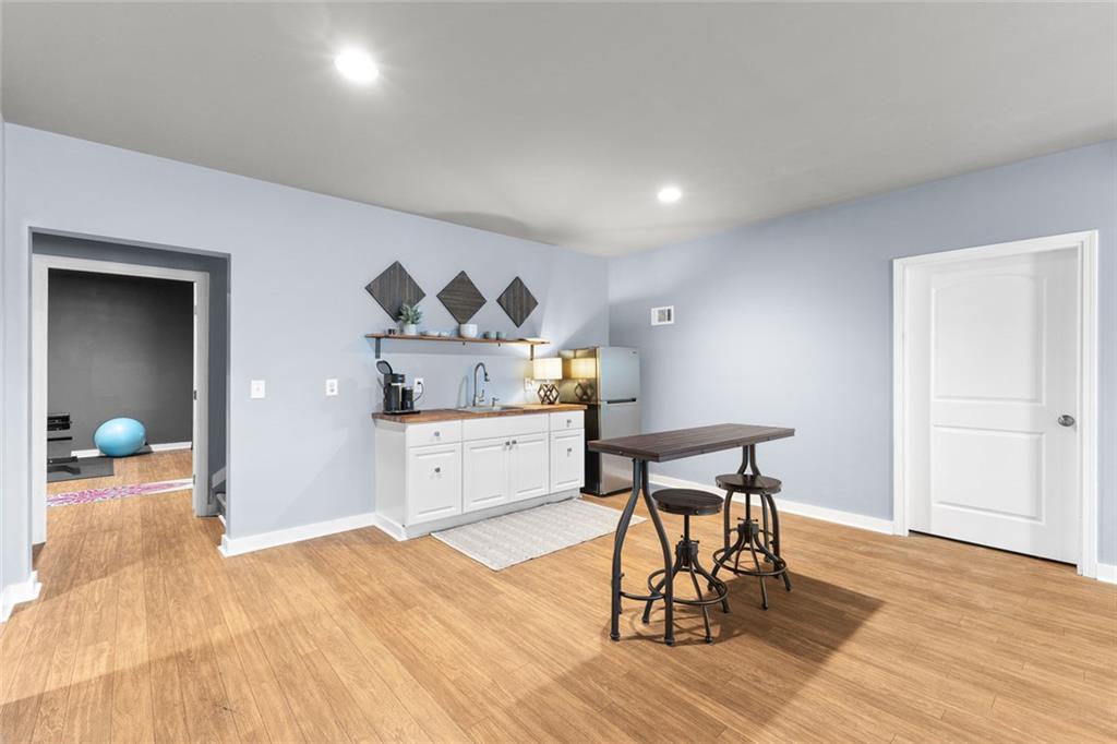 2253 Cotton Gin Row Jefferson, GA 30549 - Photo 34 of 45 a workspace with furniture and wooden floor