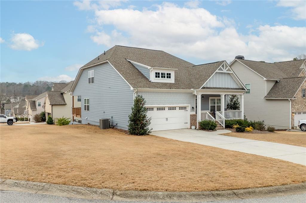 2253 Cotton Gin Row Jefferson, GA 30549 - Photo 4 of 45 a front view of a house with a yard