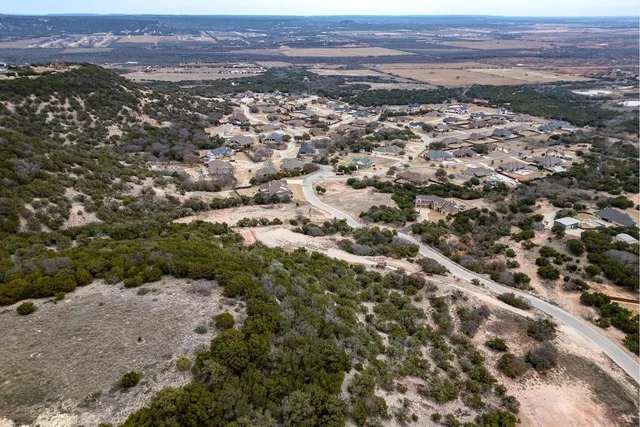 an aerial view of residential house and green space