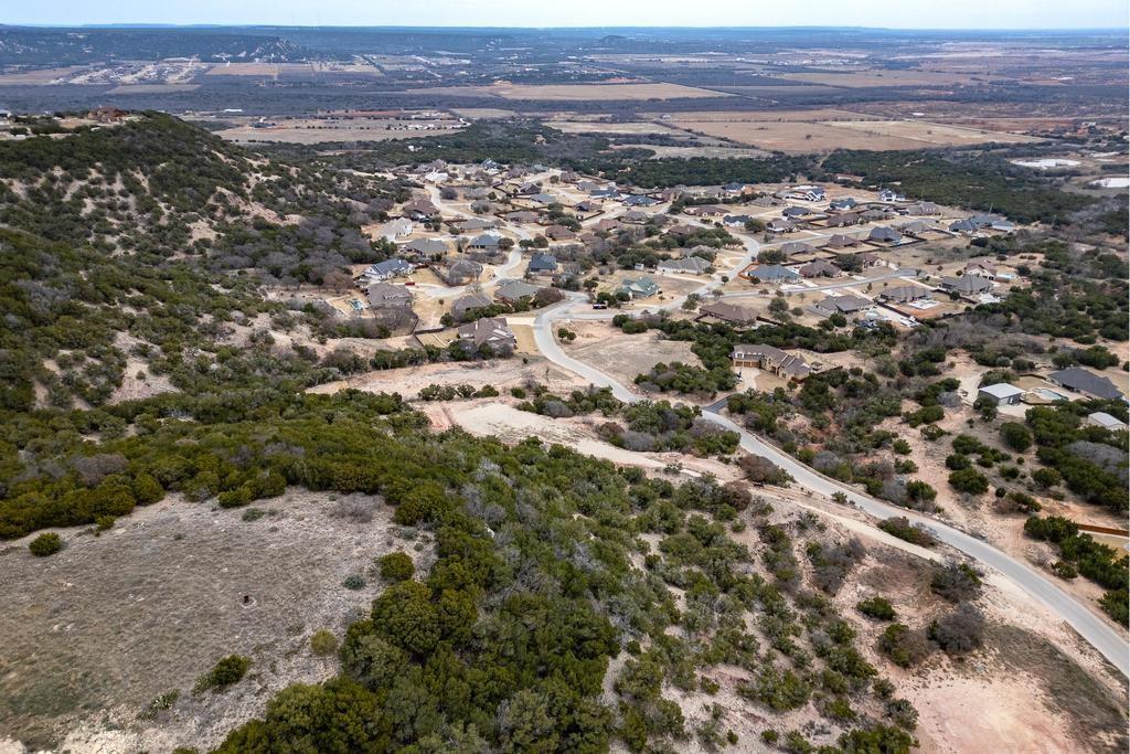 242 Cedar Crk Rnch Trail Tuscola, TX 79562 - Photo 15 of 33 an aerial view of house with yard and mountain view in back