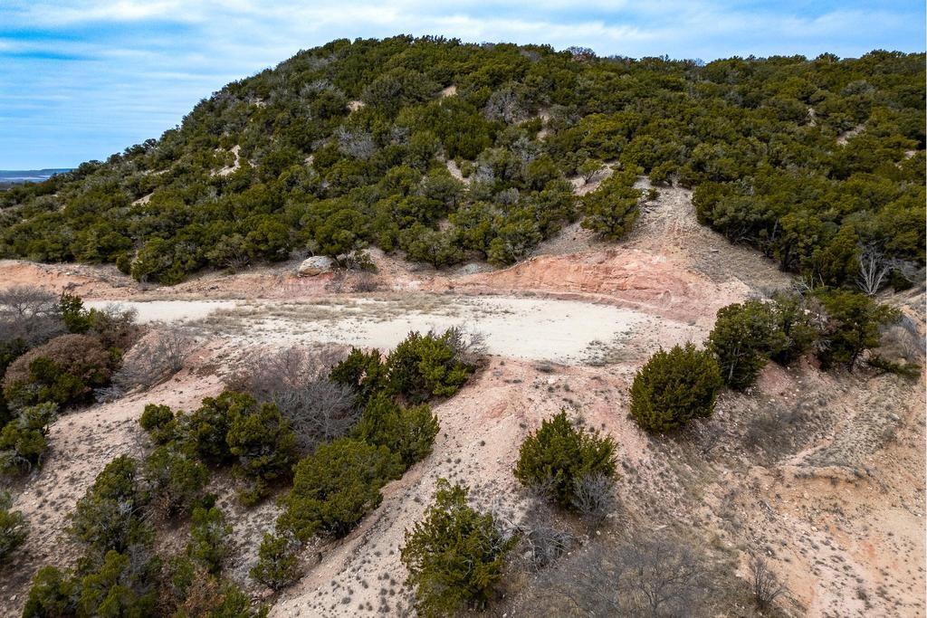 242 Cedar Crk Rnch Trail Tuscola, TX 79562 - Photo 23 of 33 a view of a road with a mountain and a forest