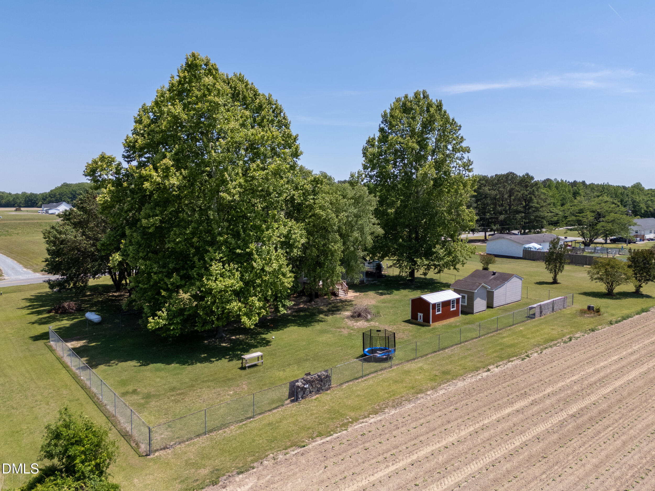 311 Bridgers Road Kenly, NC 27542 - Photo 35 of 46 an aerial view of multiple houses with yard