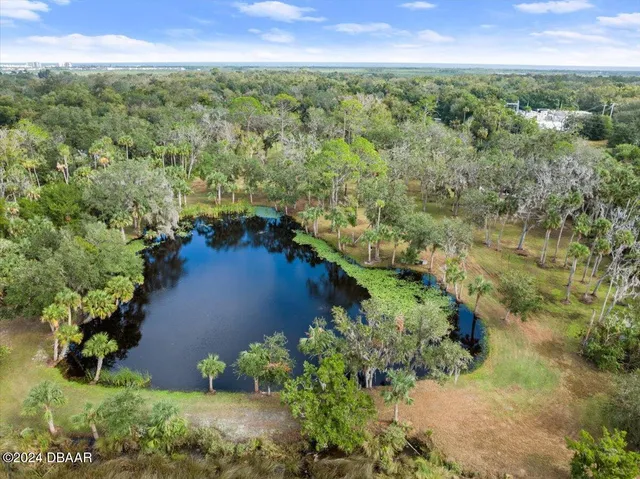 a view of a lake with a yard