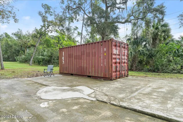 a backyard of a house with outdoor seating