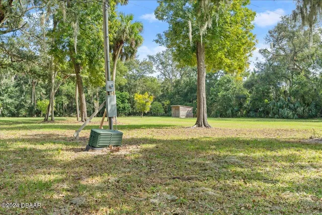 a view of a yard with an outdoor space