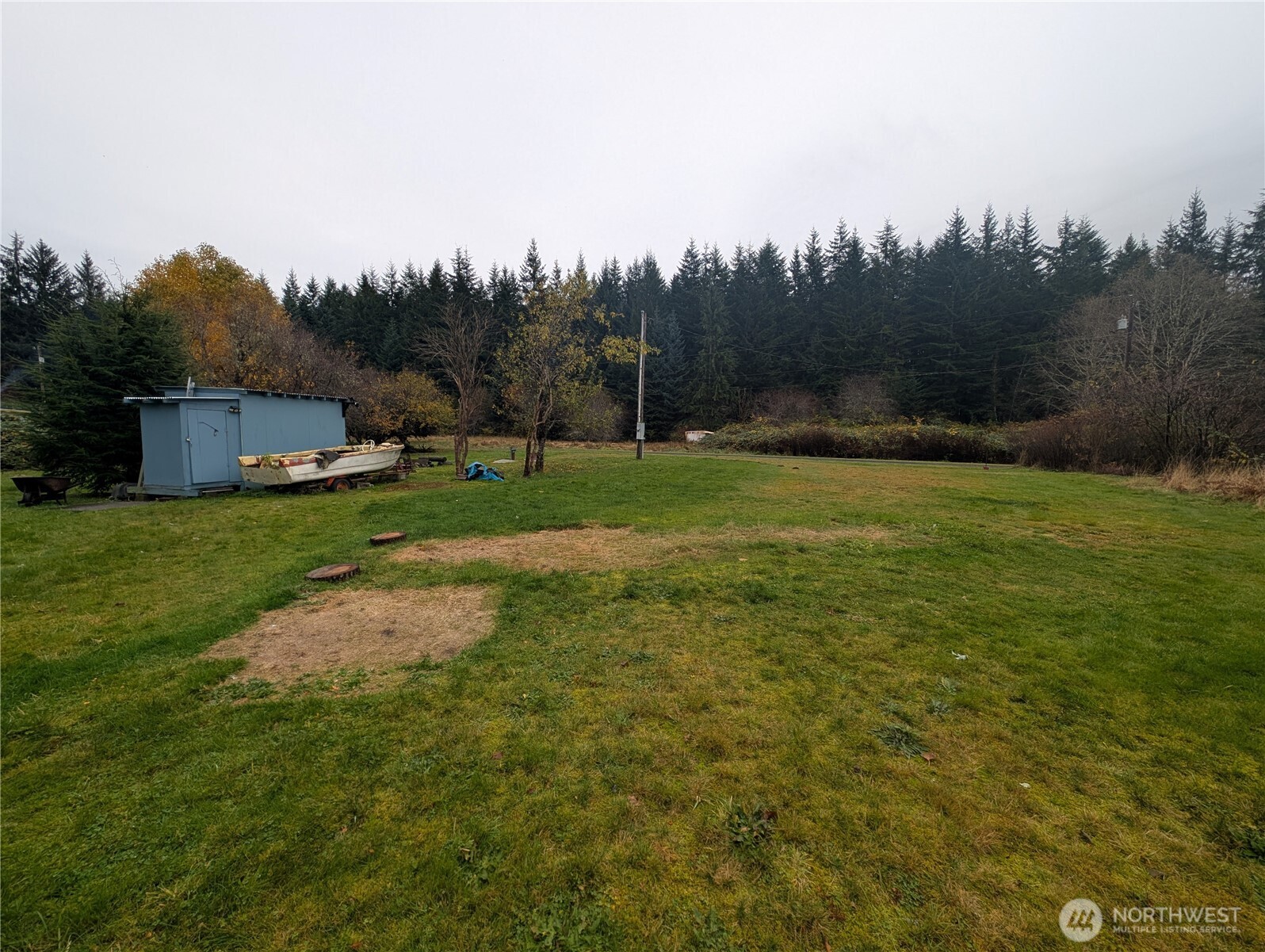 81 Barber Road Clallam Bay, WA 98326 - Photo 7 of 30 a view of a field of grass and trees
