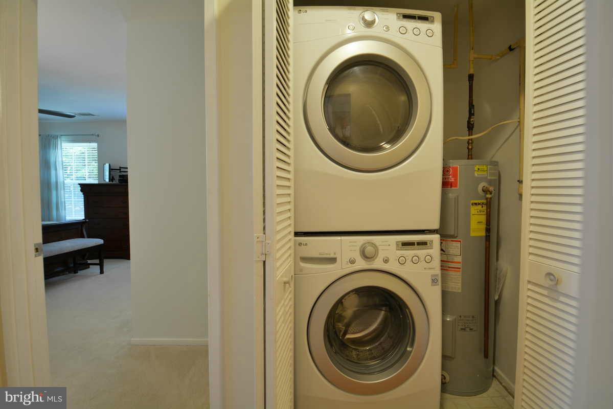 7702 Lexton Place, Unit A Springfield, VA 22152 - Photo 14 of 22 a utility room with dryer and washer