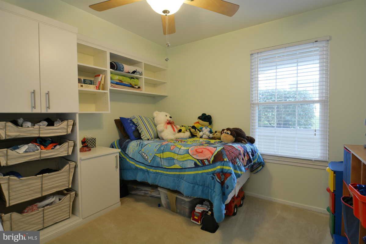 7702 Lexton Place, Unit A Springfield, VA 22152 - Photo 19 of 22 a bedroom with a bed and a window