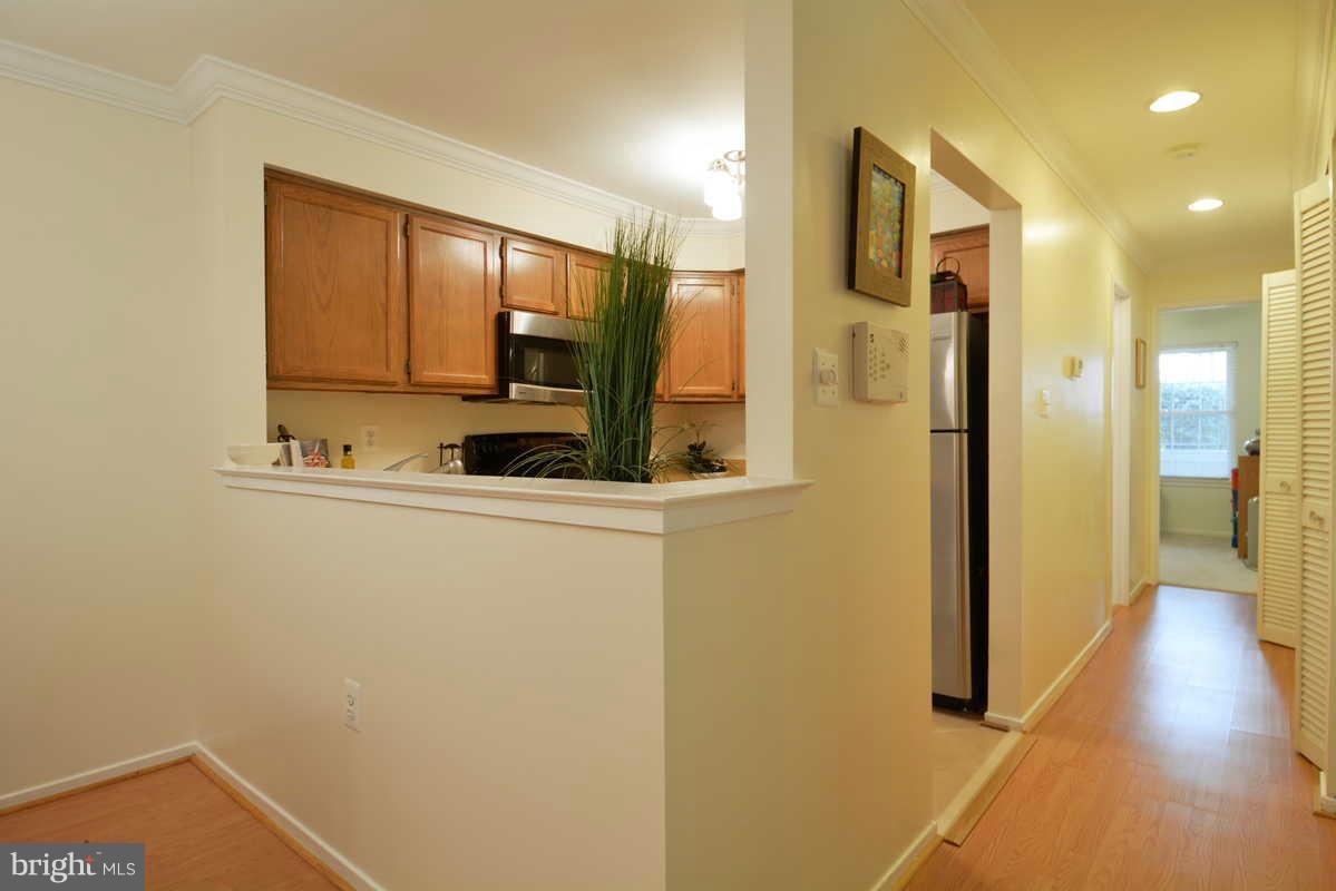 7702 Lexton Place, Unit A Springfield, VA 22152 - Photo 3 of 22 a bathroom with a sink and a mirror