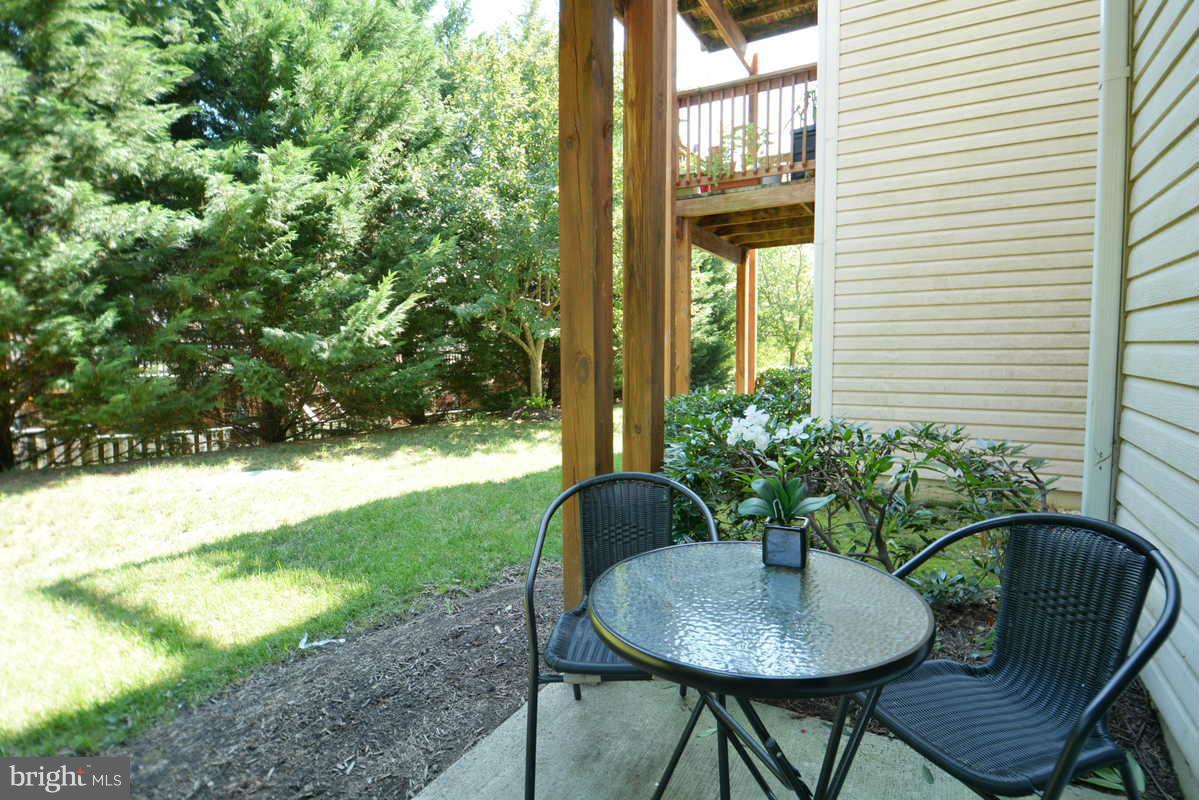 7702 Lexton Place, Unit A Springfield, VA 22152 - Photo 21 of 22 a table and chairs in the patio
