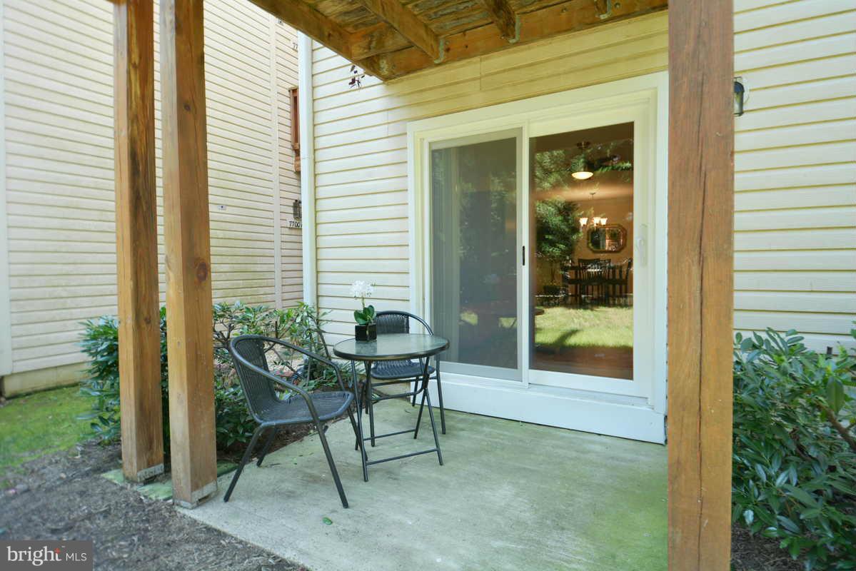 7702 Lexton Place, Unit A Springfield, VA 22152 - Photo 22 of 22 a view of a house with backyard and sitting area