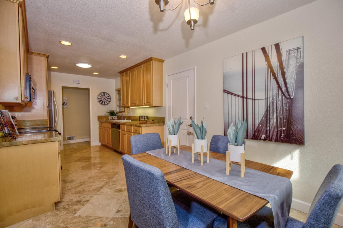 2843 Aragon Way San Jose, CA 95125 - Photo 11 of 26 a dining room with furniture a large window and kitchen view