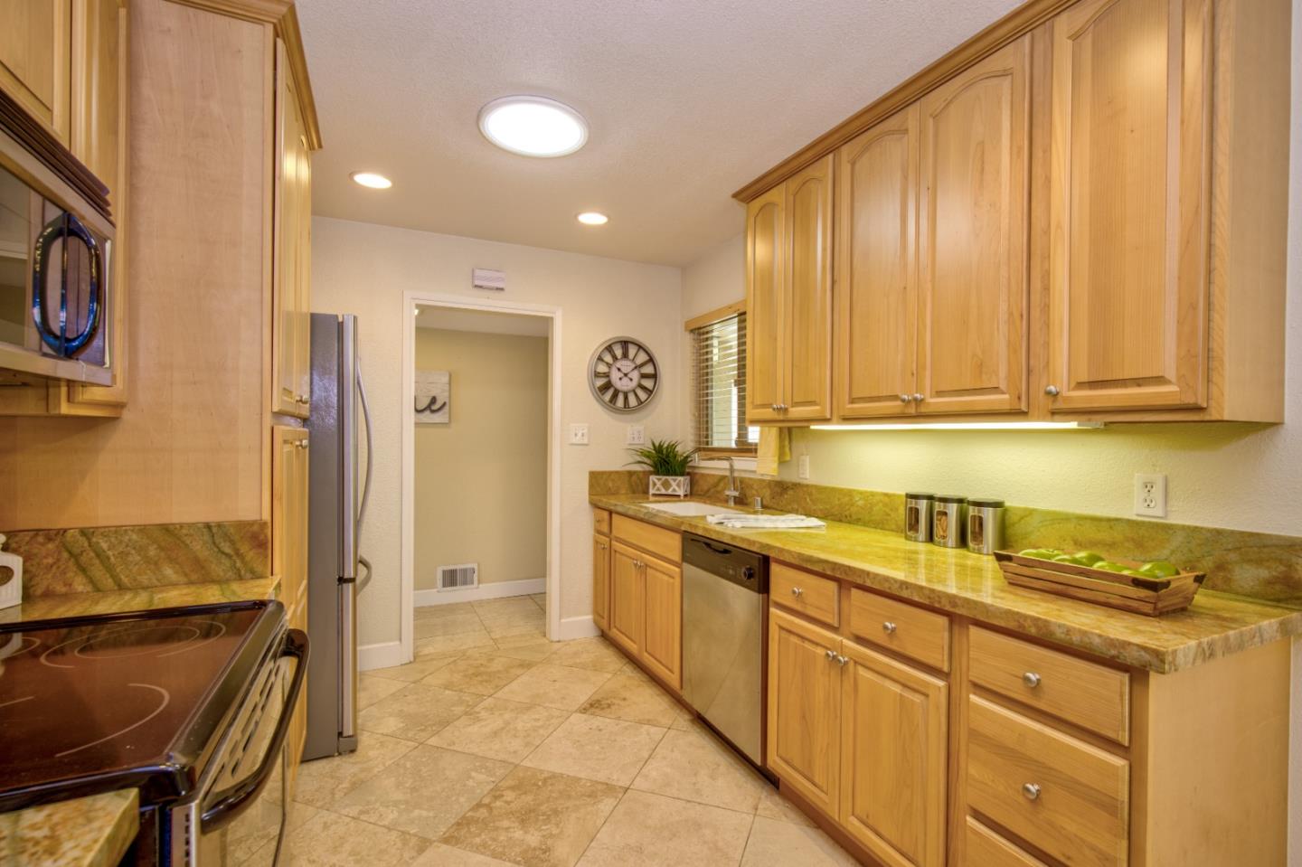 2843 Aragon Way San Jose, CA 95125 - Photo 14 of 26 a kitchen with stainless steel appliances granite countertop a refrigerator and a stove top oven