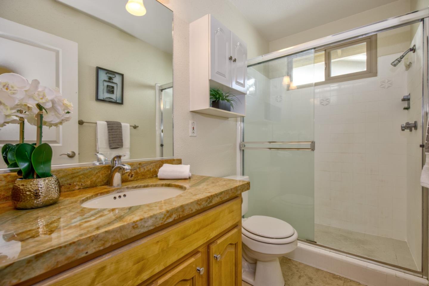 2843 Aragon Way San Jose, CA 95125 - Photo 16 of 26 a bathroom with a granite countertop sink toilet and shower
