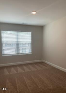 6927 Eddy Point Lane Raleigh, NC 27616 - Photo 17 of 27 an empty room with a window