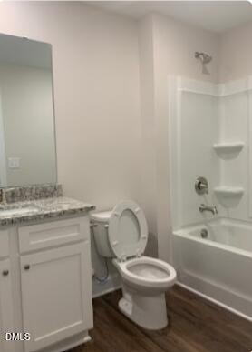 6927 Eddy Point Lane Raleigh, NC 27616 - Photo 19 of 27 a bathroom with a granite countertop toilet a sink and bathtub