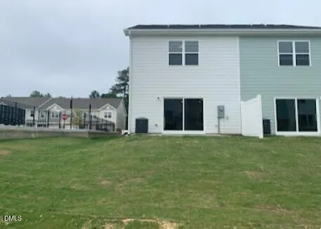 a front view of house with yard and outdoor seating