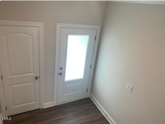 6927 Eddy Point Lane Raleigh, NC 27616 - Photo 6 of 27 a view of an empty room with wooden floor and a window