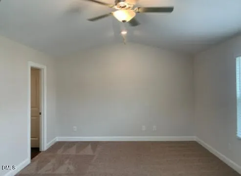 a view of an empty room with a fan