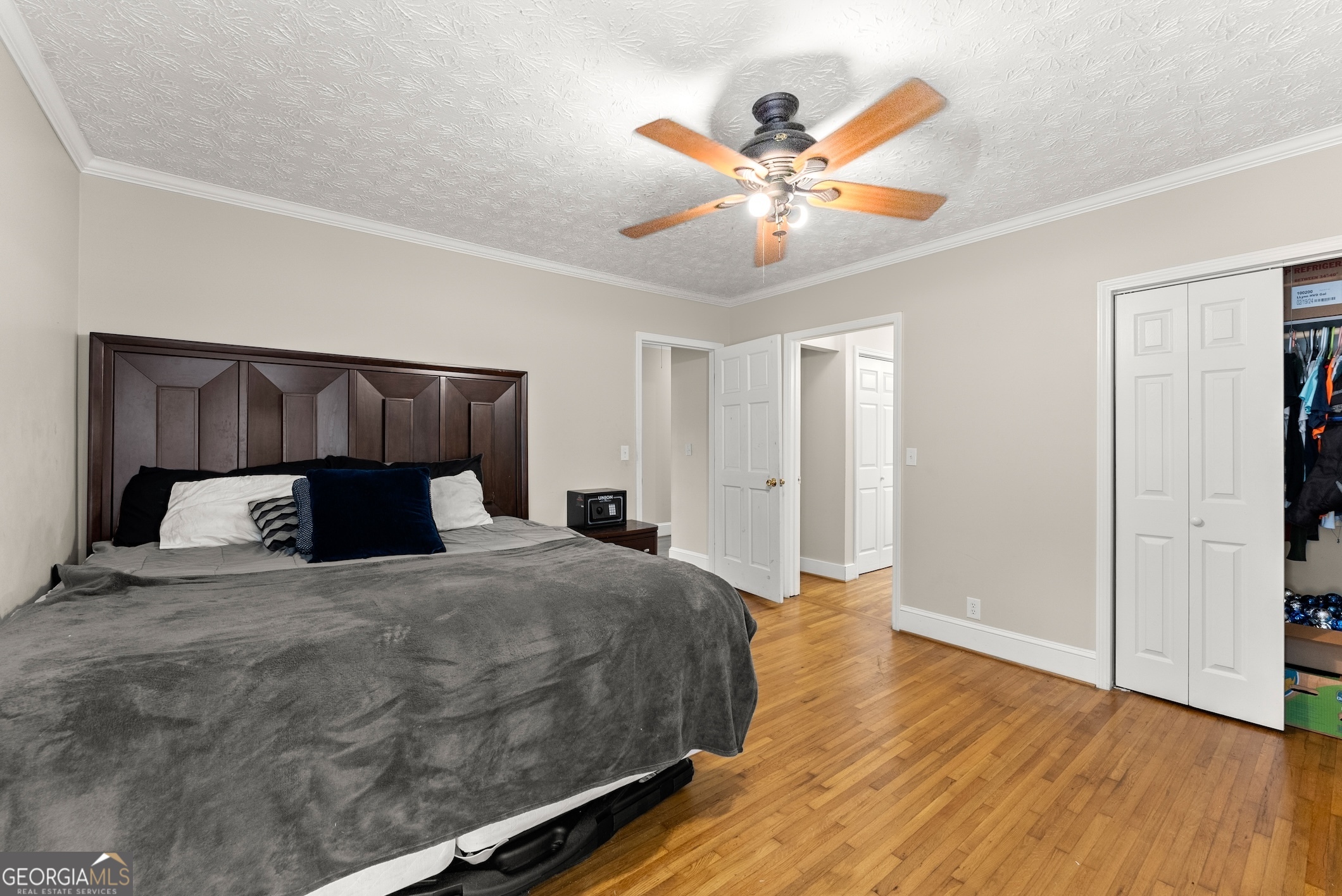 2003 West Currahee Street Toccoa, GA 30577 - Photo 16 of 34 a bedroom with a large bed and a chandelier