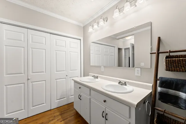 a kitchen with a stove and white cabinets