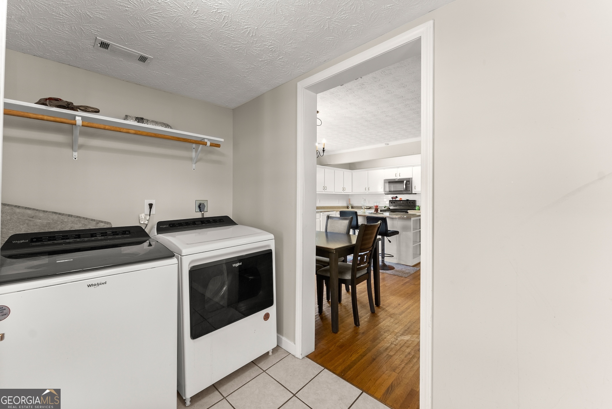 2003 West Currahee Street Toccoa, GA 30577 - Photo 19 of 34 a kitchen with a stove and white cabinets