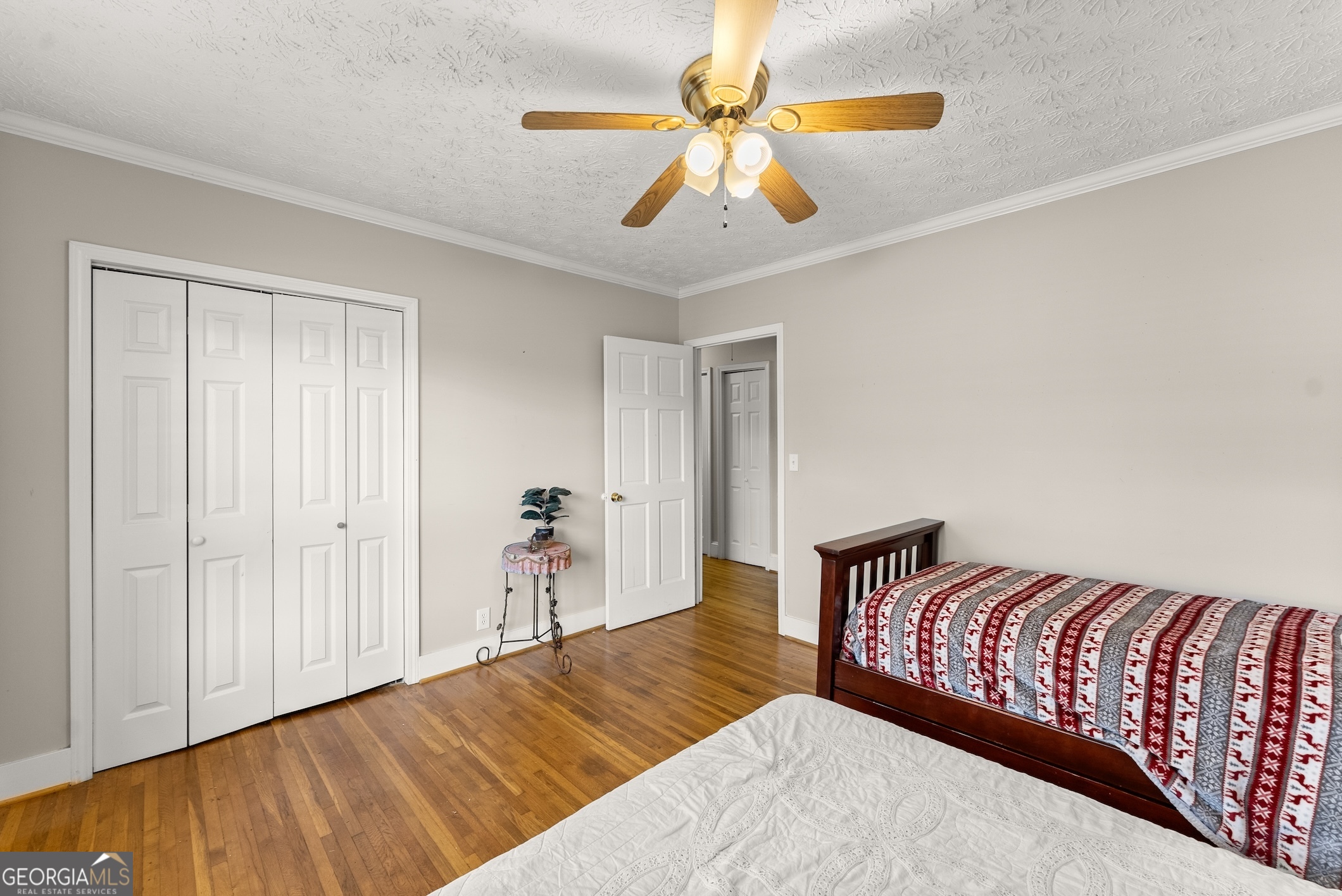 2003 West Currahee Street Toccoa, GA 30577 - Photo 23 of 34 a bedroom with a bed and a chandelier
