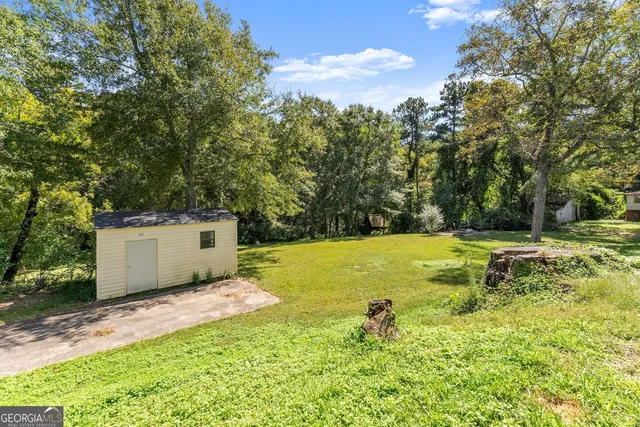 a view of house with yard