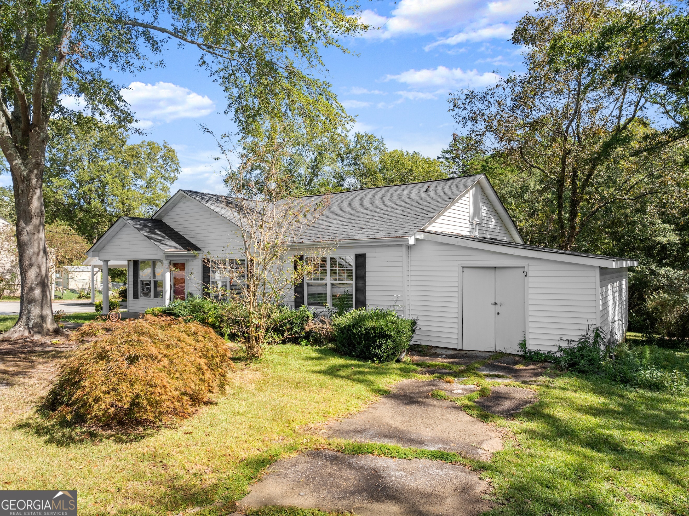 2003 West Currahee Street Toccoa, GA 30577 - Photo 3 of 34 a front view of a house with a yard