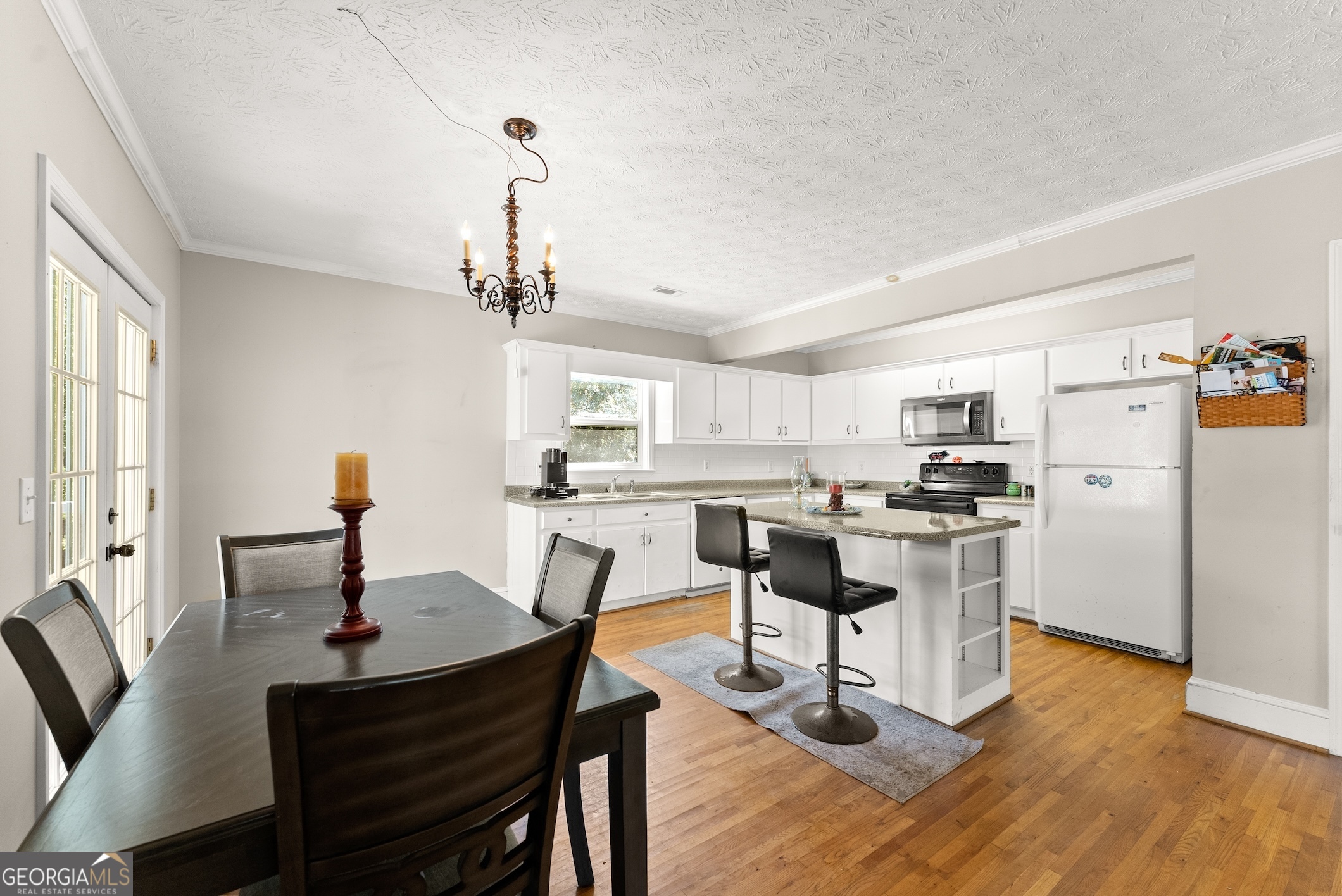 2003 West Currahee Street Toccoa, GA 30577 - Photo 8 of 34 a view of a dining room with furniture window and wooden floor