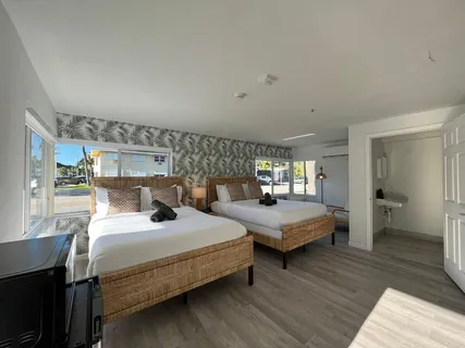 a white toilet sitting next to a bathroom sink