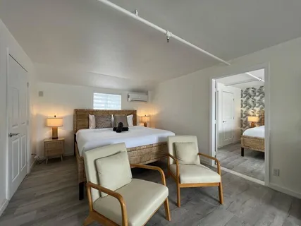 a bedroom with a bed and a couch