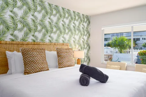 a bedroom with a bed and lamp