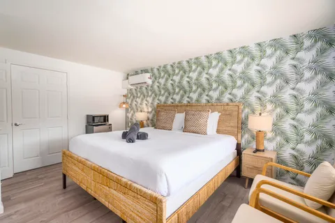 a room with a dresser and a window