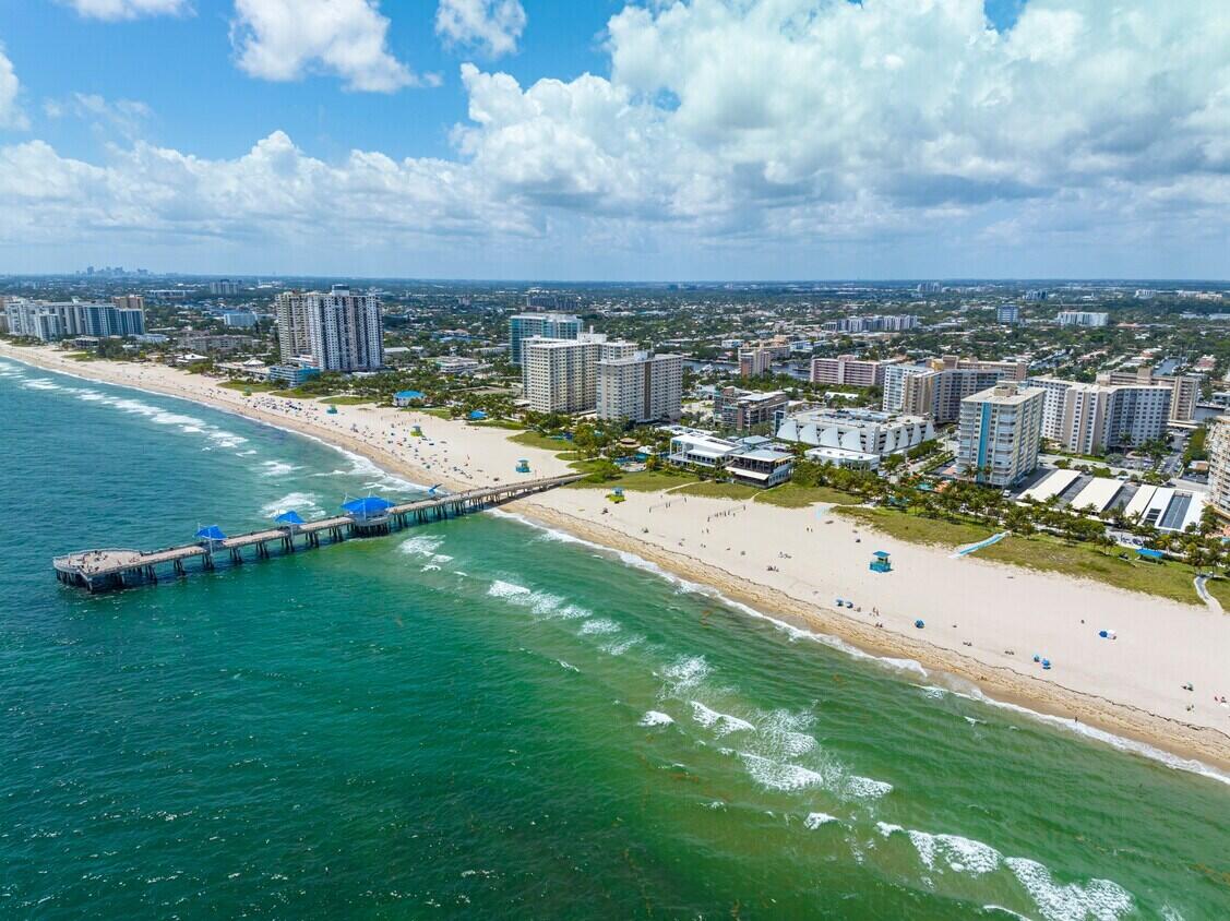 1020 North Riverside Drive Pompano Beach, FL 33062 - Photo 8 of 32 a view of a lake with a big yard