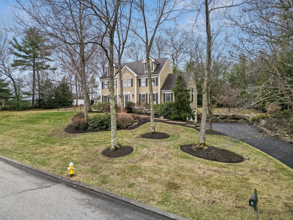 a front view of a house with yard