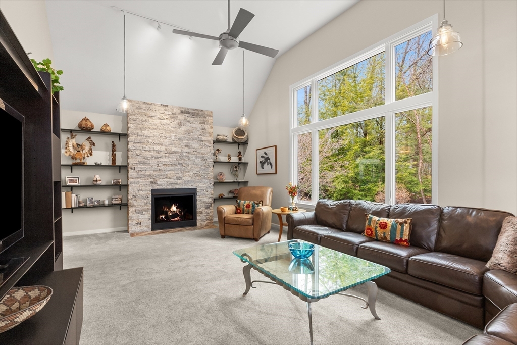 7 Derosier Drive Middleton, MA 01949 - Photo 14 of 42 a living room with furniture large window and a flat screen tv