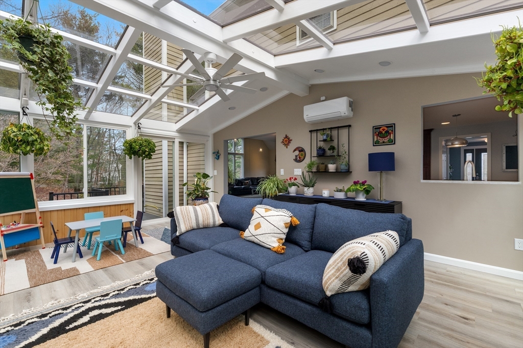 7 Derosier Drive Middleton, MA 01949 - Photo 17 of 42 a outdoor living room with furniture and wooden floor