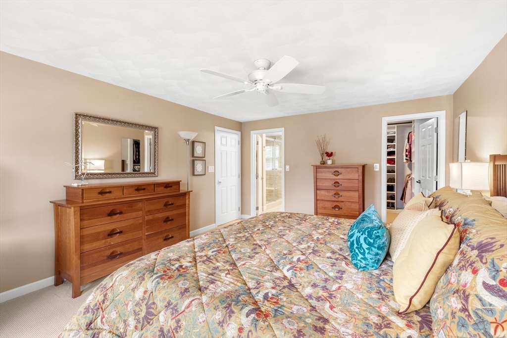 7 Derosier Drive Middleton, MA 01949 - Photo 23 of 42 a bedroom with a bed and a dresser