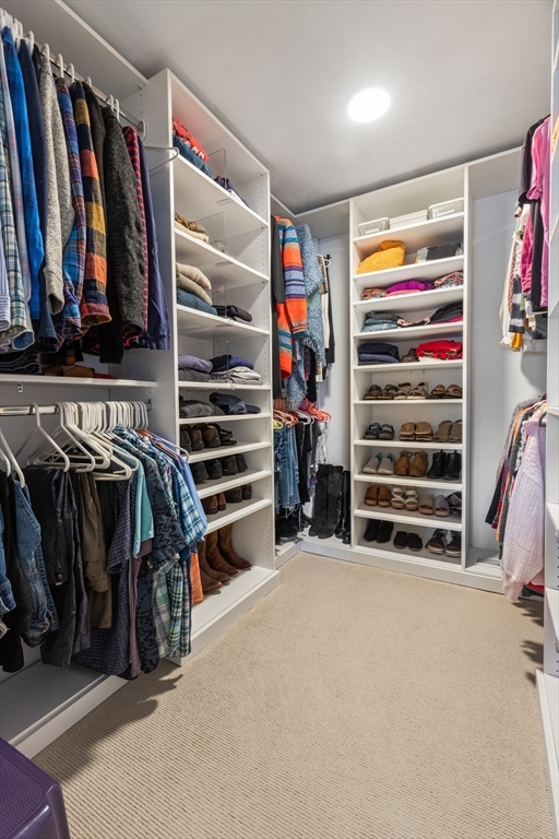 7 Derosier Drive Middleton, MA 01949 - Photo 24 of 42 a view of walk in closet with clothes and shoes