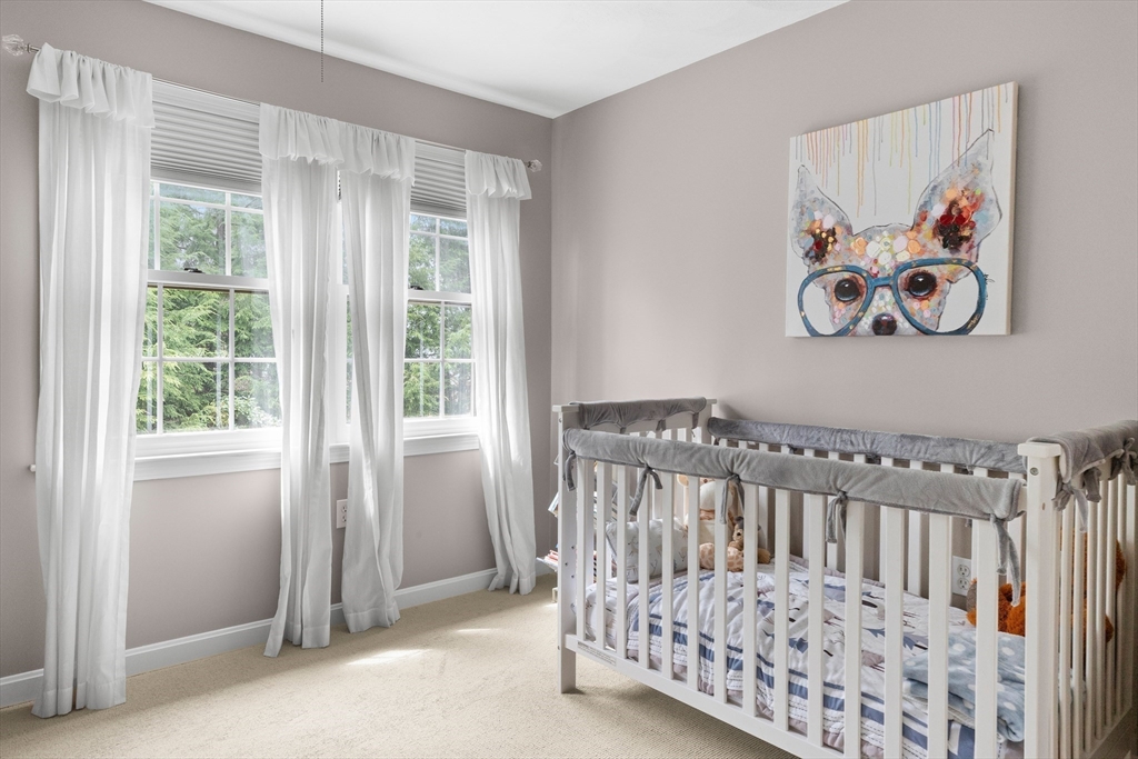 7 Derosier Drive Middleton, MA 01949 - Photo 28 of 42 a view of a bedroom with wooden floor and a window