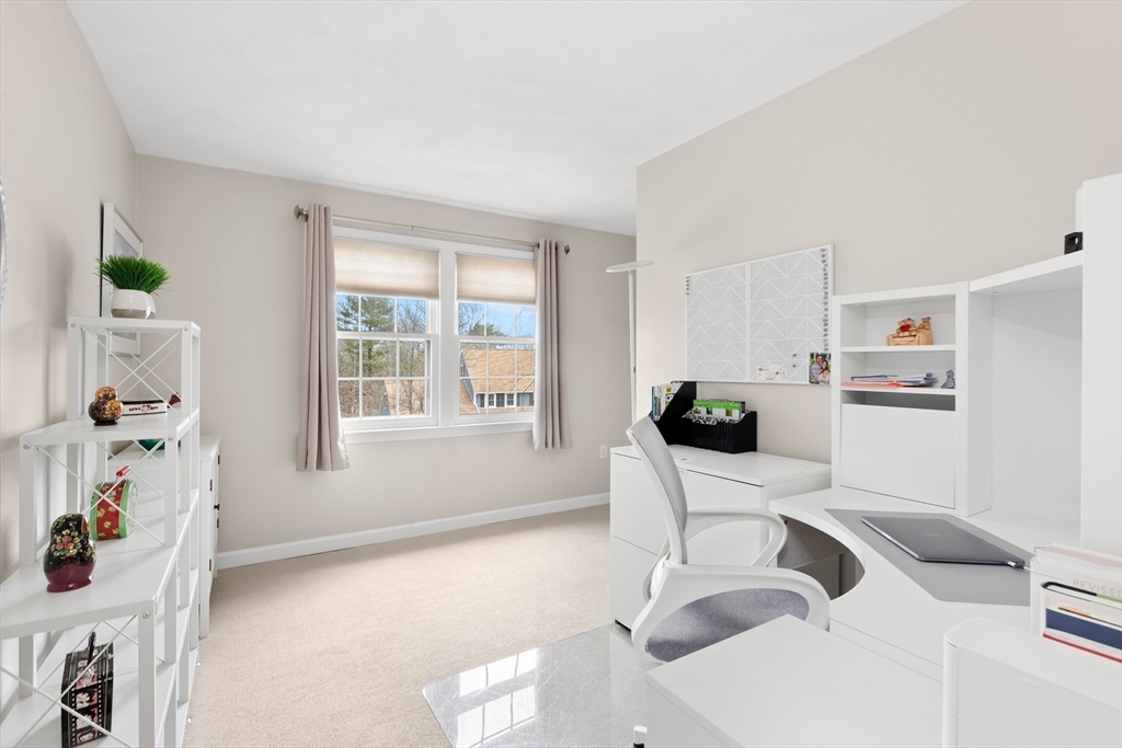 7 Derosier Drive Middleton, MA 01949 - Photo 29 of 42 a living room with furniture and a window