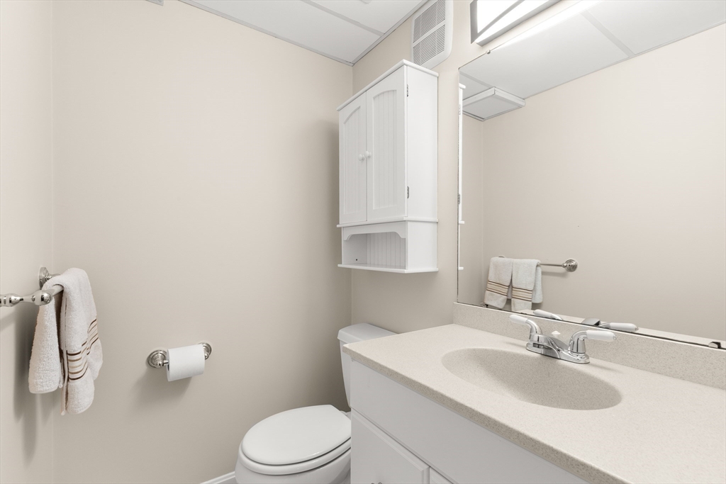 7 Derosier Drive Middleton, MA 01949 - Photo 33 of 42 a bathroom with a sink a toilet and a mirror