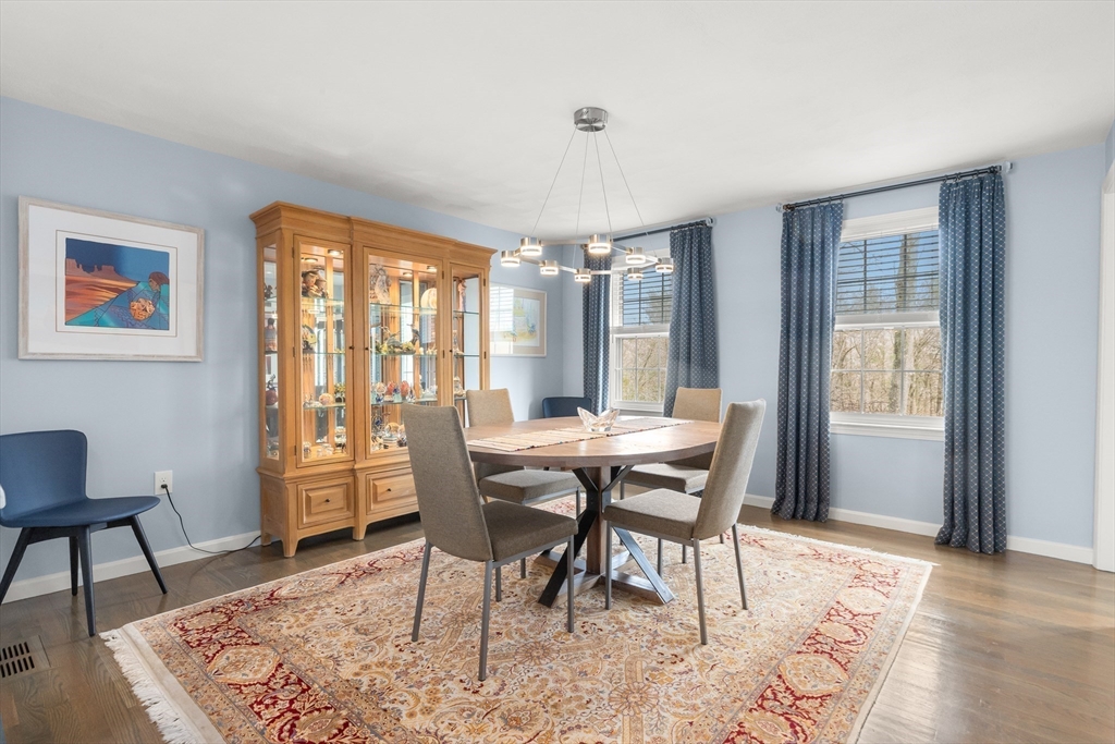 7 Derosier Drive Middleton, MA 01949 - Photo 6 of 42 a view of a dining room with furniture window and wooden floor