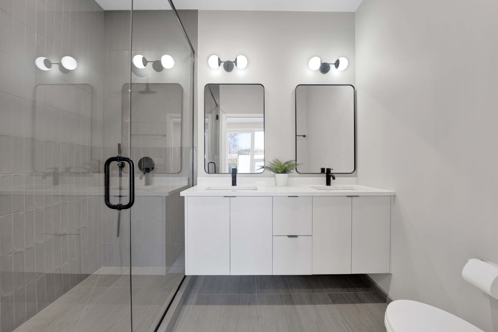 944 Beloit Avenue, Unit 4 Forest Park, IL 60130 - Photo 20 of 31 a bathroom with a double vanity sink a toilet and a mirror