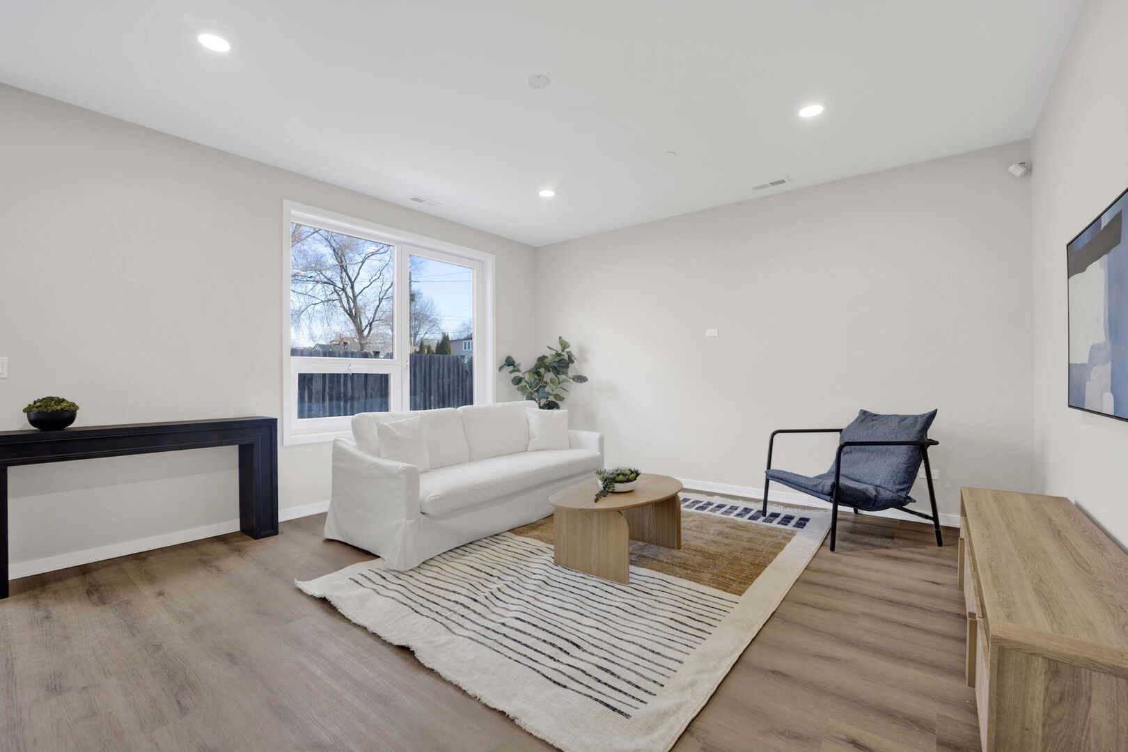 944 Beloit Avenue, Unit 4 Forest Park, IL 60130 - Photo 3 of 31 a living room with furniture and a wooden floor
